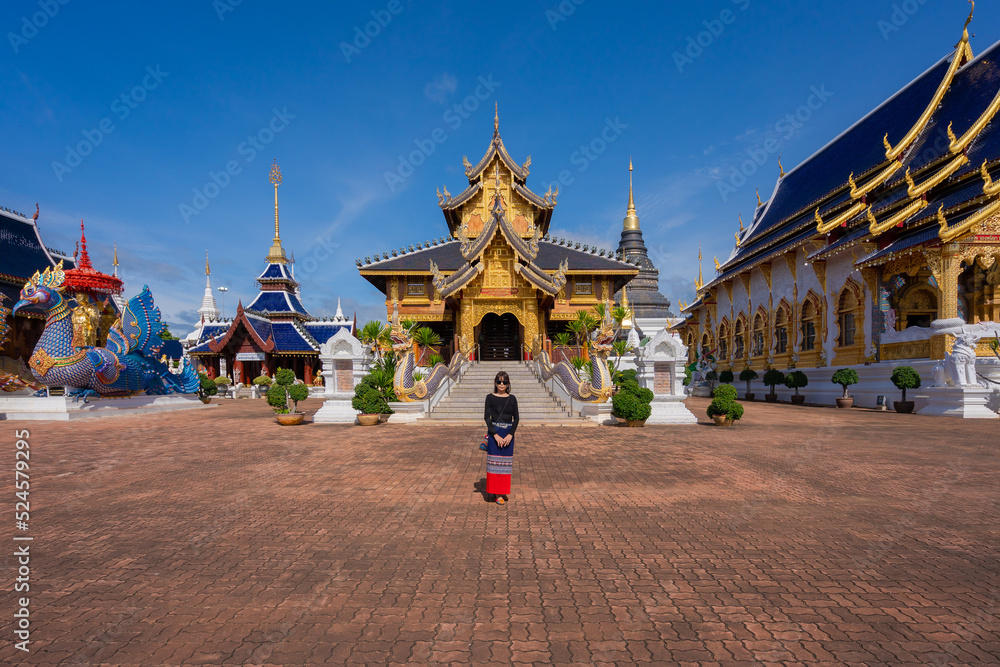 Asian traveller women wearing traditional clothes at beautiful Wat Ban Den Temple is a famous place and travel destination attraction in Mae Tang district Chiang Mai, Northern Thailand. Religion worsh