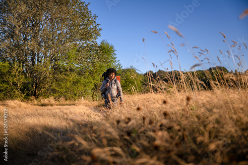 U.S. Army female soldier putting in the miles with an early morning hike in the NorthWest.