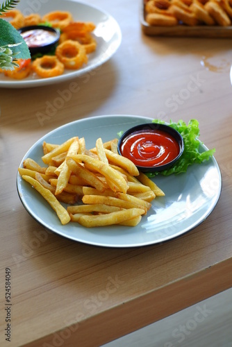 a plate of frech fries on the table