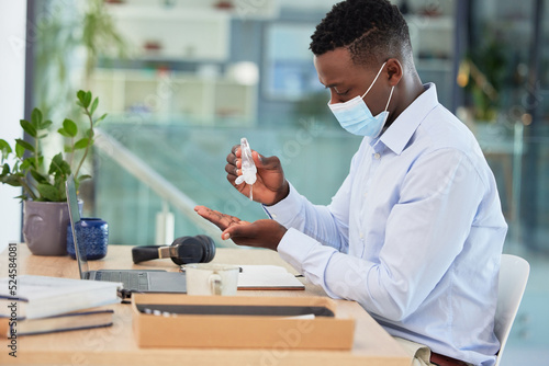 Billede på lærred Hygiene, compliance and covid rules at work with a business man sanitize hands before a shift