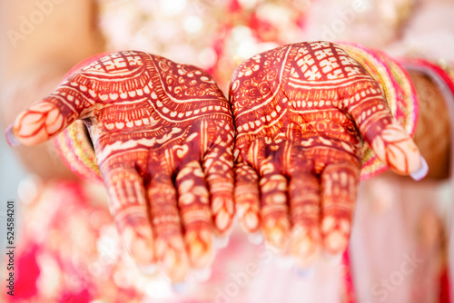 Beautiful henna design on the hand of a Hindu bride on her wedding eve.
