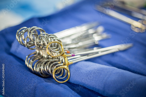 A group of hemostats in an operating room