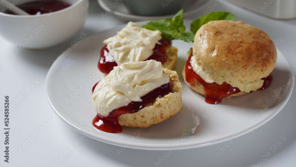 British scones with fruit jam and whipped cream British scones with fruit jam and whipped cream