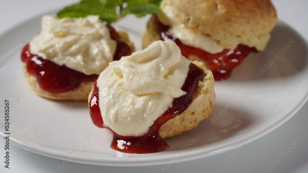 British scones with fruit jam and whipped cream