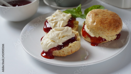 British scones with fruit jam and whipped cream