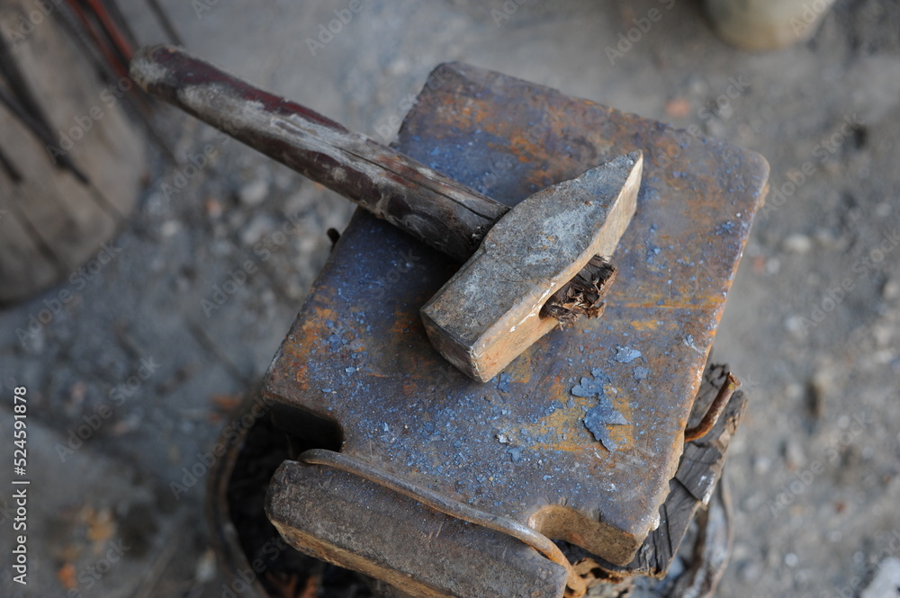 Almaty, Kazakhstan - 09.24.2015 : Various blacksmith's tools on a wooden stand in the workshop Almaty, Kazakhstan - 09.24.2015 : Various blacksmith's tools on a wooden stand in the workshop