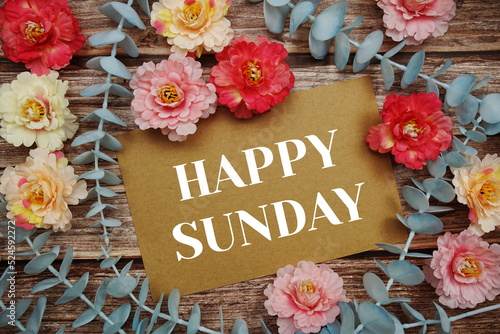 Happy Sunday typography text on paper card decorate with flower on wooden background © may1985