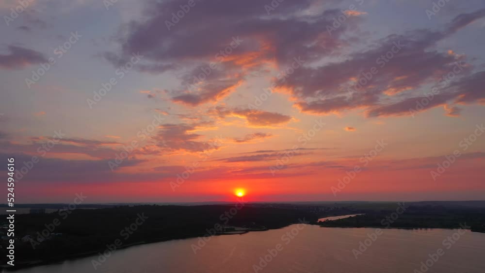The sun sets over the horizon. Filmed in UHD 4k video. The sun sets over the horizon. Filmed in UHD 4k video.