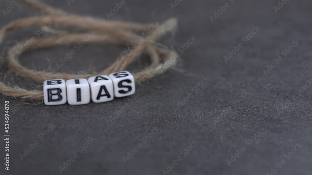 BIAS text on white cubes with string.
BIAS text on white cubes with string.