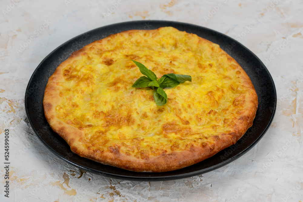 baked kubdari flatbread in a plate
baked kubdari flatbread in a plate