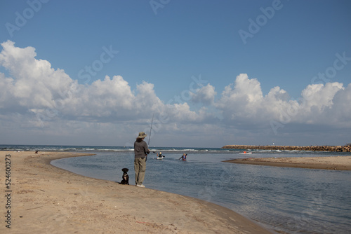 Fisherman on the banks of the Yarkon River photo