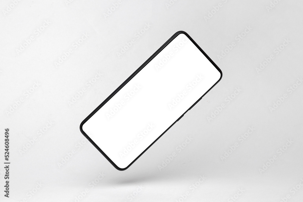 Modern smartphone mockup with white screen flying in antigravity on gray background with shadow. Levitation object in the air. Creative minimal layout Modern smartphone mockup with white screen flying in antigravity on gray background with shadow. Levitation object in the air. Creative minimal layout