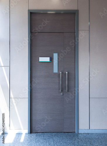 Gray metal door with modern background