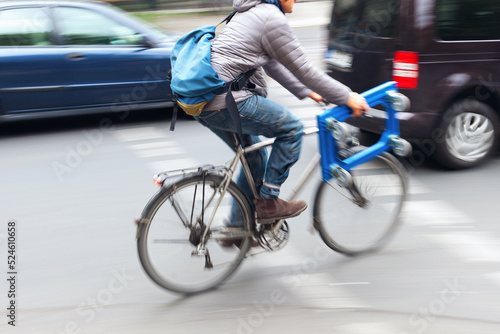 bicycle rider in city traffic