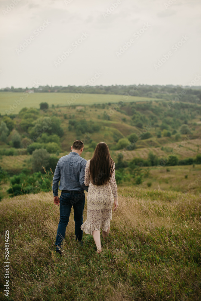 Lovers are walking in the park in nature