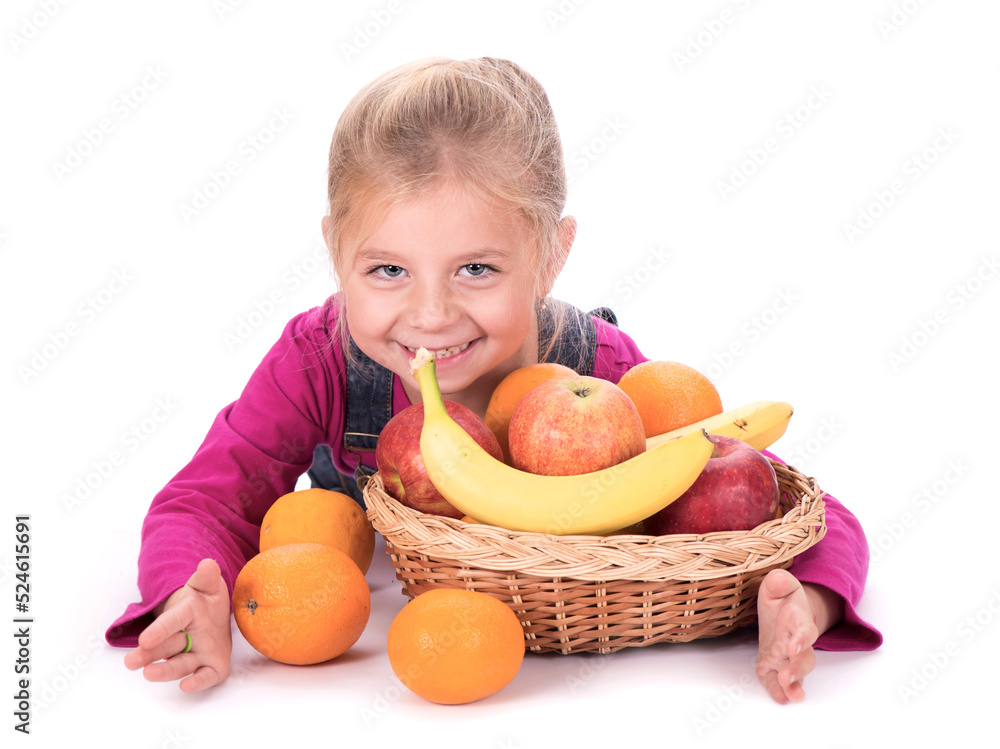 Close-up portrait of a little girl holding fruits - apples, bananas and oranges. Isolated on a light background. Close-up portrait of a little girl holding fruits - apples, bananas and oranges. Isolated on a light background.
