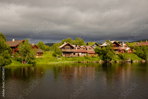 Small village with typical houses for Southwest Norway on the shore of Lysebotn fjord