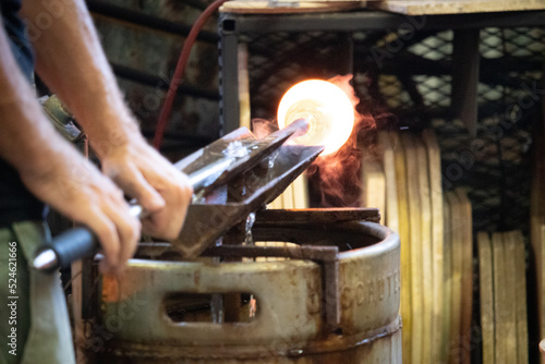 Glass blowing with visible smoke 