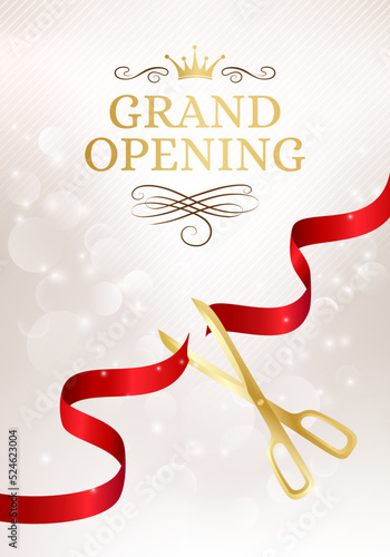 Grand opening banner with cut red ribbon and gold scissors.