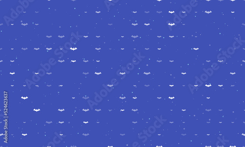 Seamless background pattern of evenly spaced white bat symbols of different sizes and opacity. Vector illustration on indigo background with stars