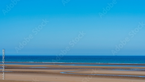 Fototapeta Naklejka Na Ścianę i Meble -  Panoramic beach landscape with clear skies in relaxing summer atmosphere