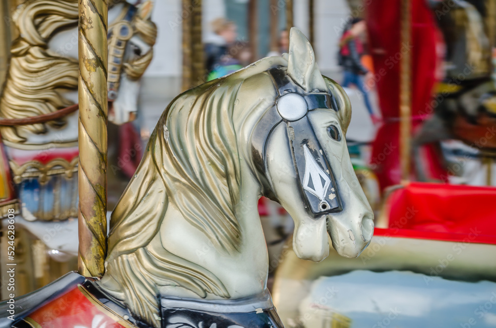 The decorations on the children's carousel with wooden horses The decorations on the children's carousel with wooden horses