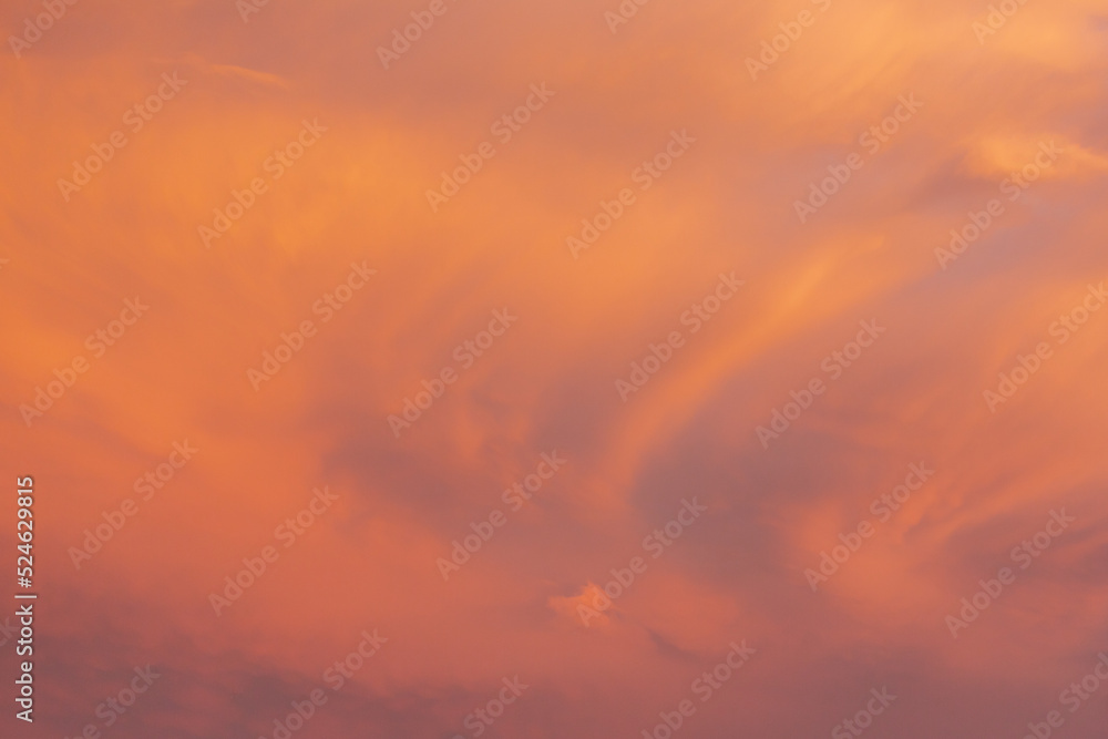 Red yellow and orange sunset. Dramatic sunset with evening sky clouds illuminated by bright sunlight