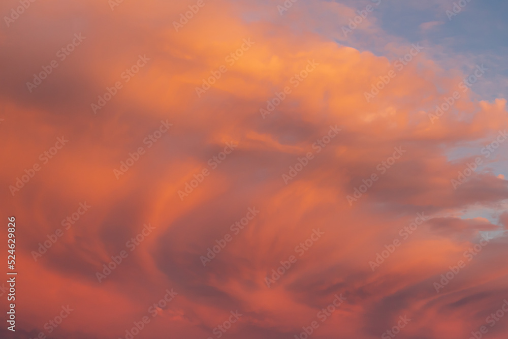 Red yellow and orange sunset. Dramatic sunset with evening sky clouds illuminated by bright sunlight