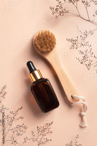 Unbranded serum bottle and anti-cellulite brush for dry body massage. Organic scin care. Prevent cellulite and body problem.