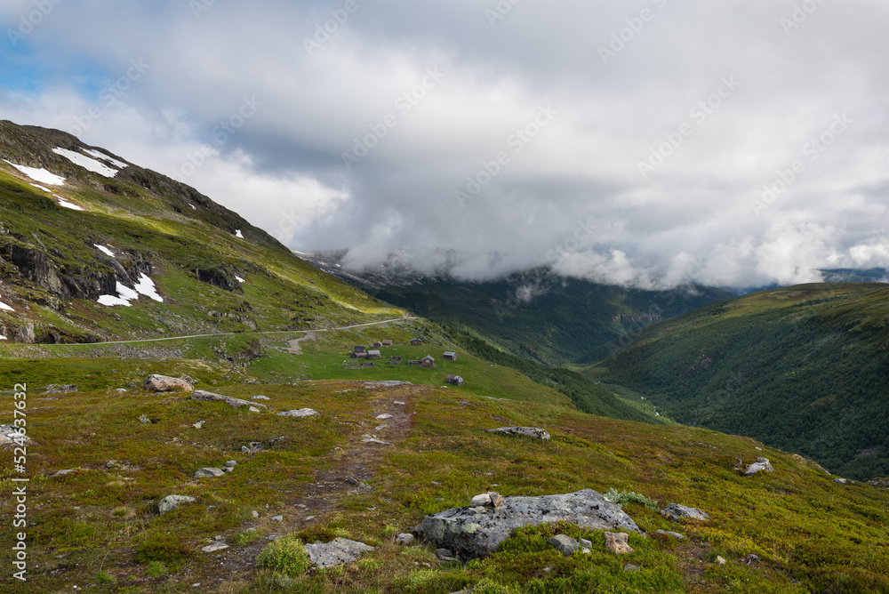 Majestic landscapes with lakes, rocks and snowcapped mountains on the Aurlandsfjellet scenic route, Norway