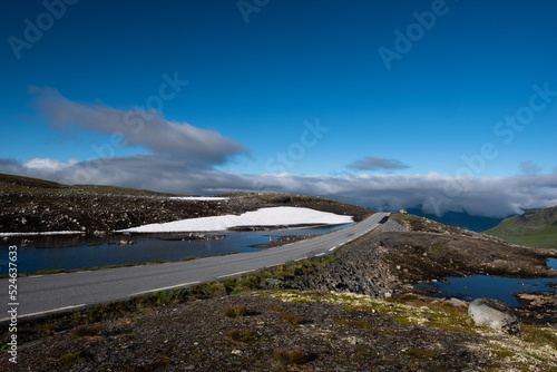 Majestic landscapes with lakes, rocks and snowcapped mountains on the Aurlandsfjellet scenic route, Norway