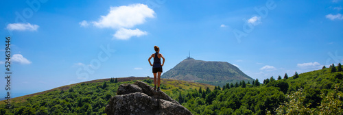 standing woman looking at panoramic view of Puy de Dome photo