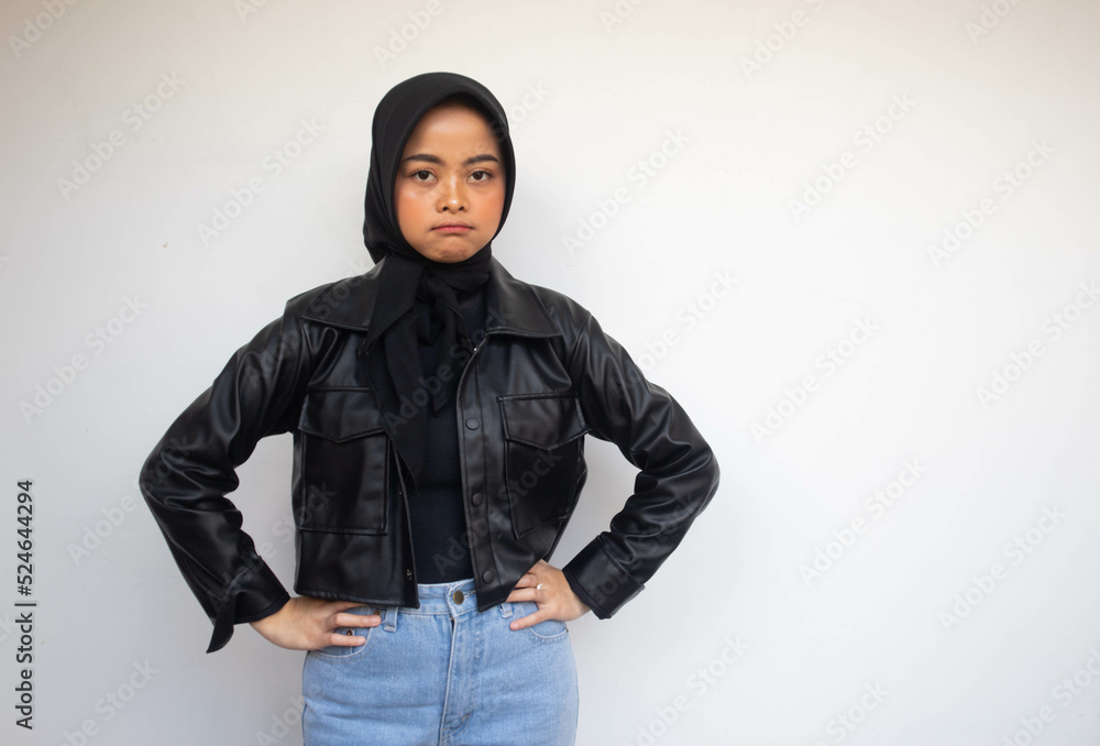 Beautiful young Asian Muslim woman keep hands on waist to show feeling annoyed isolated over white background Beautiful young Asian Muslim woman keep hands on waist to show feeling annoyed isolated over white background