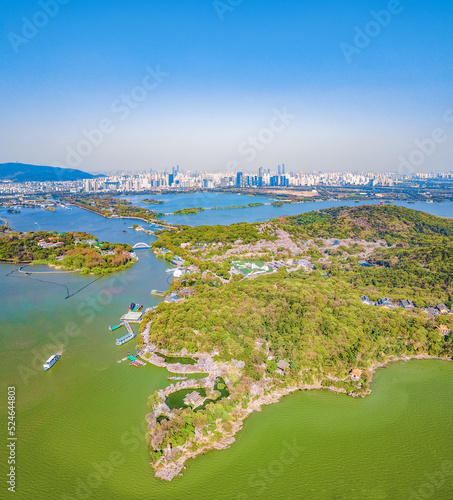 Aerial photography of Yuantouzhu scenic spot with cherry blossoms blooming in Wuxi City, Jiangsu Province, China in spring