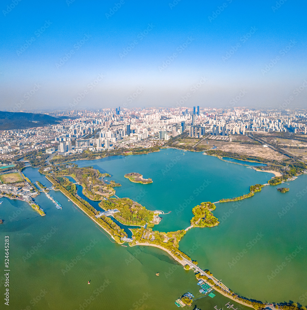 Aerial photography of Bogong Island Ecological Park, Yuantouzhu Scenic Area and the city center building complex in Wuxi City, Jiangsu Province, China