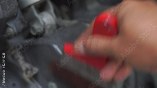 cleaning a motorcycle with a brush taken close up