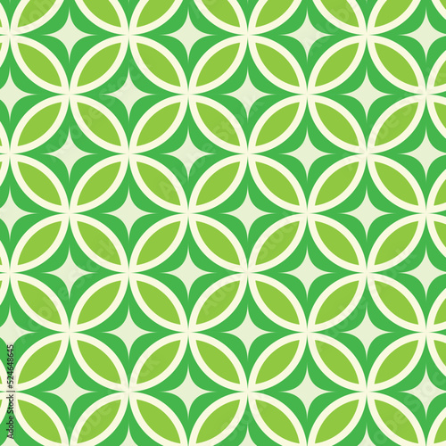 Mid century modern dark green starbursts on lime green circle leaves seamless pattern. For home décor, textile, fabric and wrapping paper 