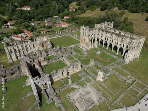 Rievaulx Abbey ree-VOH was a Cistercian abbey in Rievaulx, situated near Helmsley in the North York Moors National Park, North Yorkshire, England photo