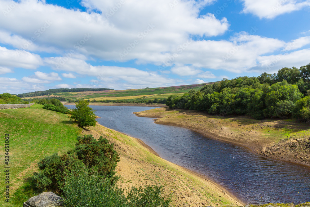 Leighton Reservoir in Nidderdale, North Yorkshire, UK in August 2022  with seriously low water levels due to no rainfall for many weeks resulting in a hosepipe ban.  Horizontal. Copy space