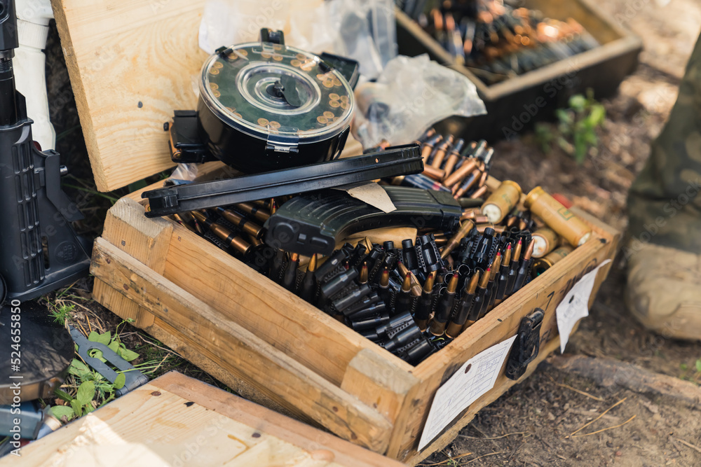 Military equipment bullets ammunition clips stored in wooden boxes