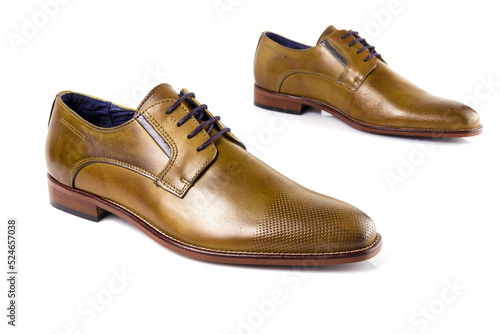 Male brown leather shoes on white background, isolated product. Differentiated footwear and exclusive design.