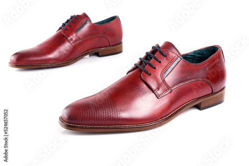 Male red leather shoes on white background, isolated product. Differentiated footwear and exclusive design.