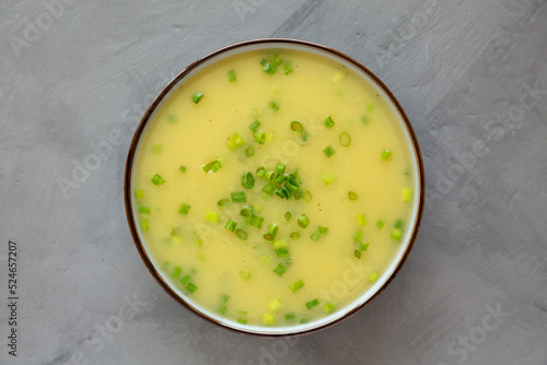 Homemade Potato Leek Soup in a Bowl on a gray background, top view. Flat lay, overhead, from above.
