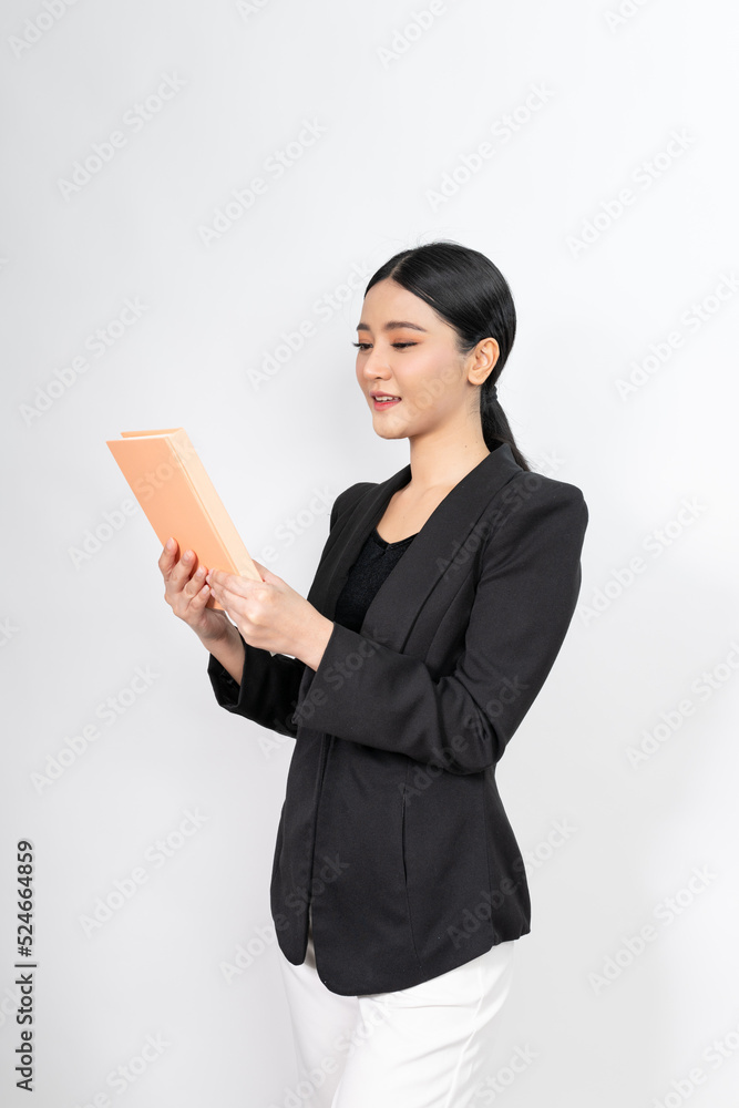 Portrait photo of a young beautiful and elegant asian woman holding a note book with a good nice friendly smile and different poses and emotion Portrait photo of a young beautiful and elegant asian woman holding a note book with a good nice friendly smile and different poses and emotion