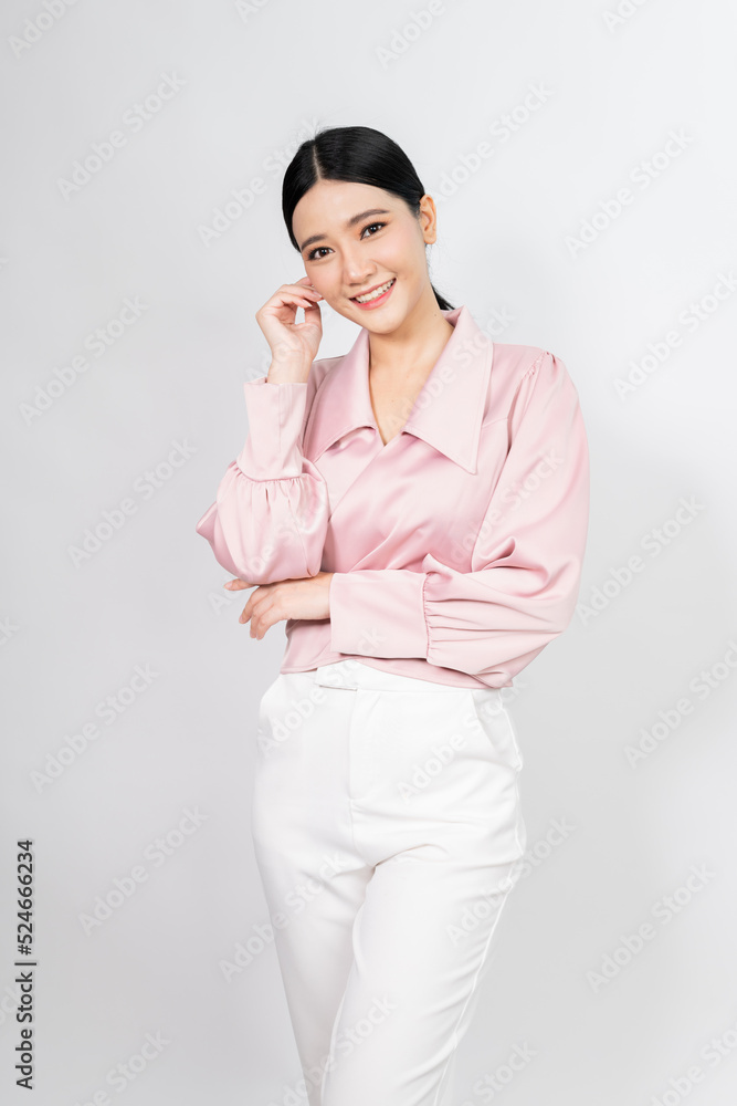 Portrait photo of a young beautiful classy and elegant asian businesswoman in smart casual pink business shirt with friendly nice smile and pose Portrait photo of a young beautiful classy and elegant asian businesswoman in smart casual pink business shirt with friendly nice smile and pose
