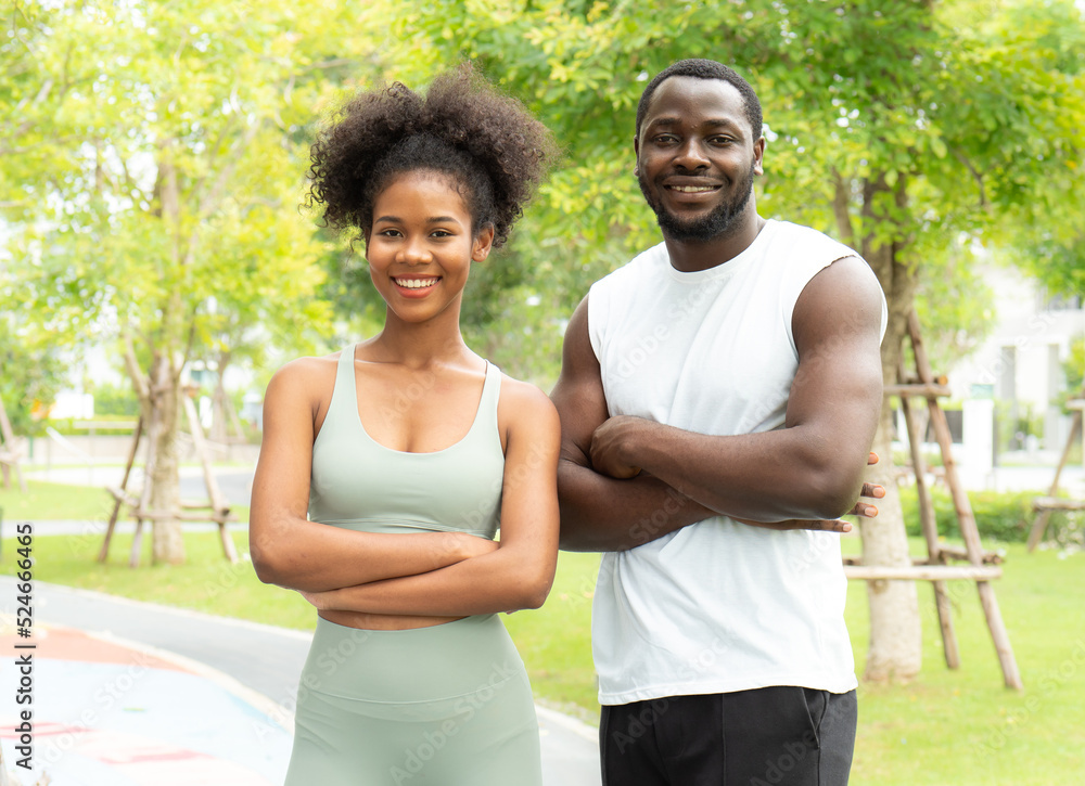 Smiling young black couple, man and woman happy relaxing together outdoor in the park. Portrait of romantic man carefree dating afro hair girlfriend. Two people, husband and wife have fun leisure. Smiling young black couple, man and woman happy relaxing together outdoor in the park. Portrait of romantic man carefree dating afro hair girlfriend. Two people, husband and wife have fun leisure.