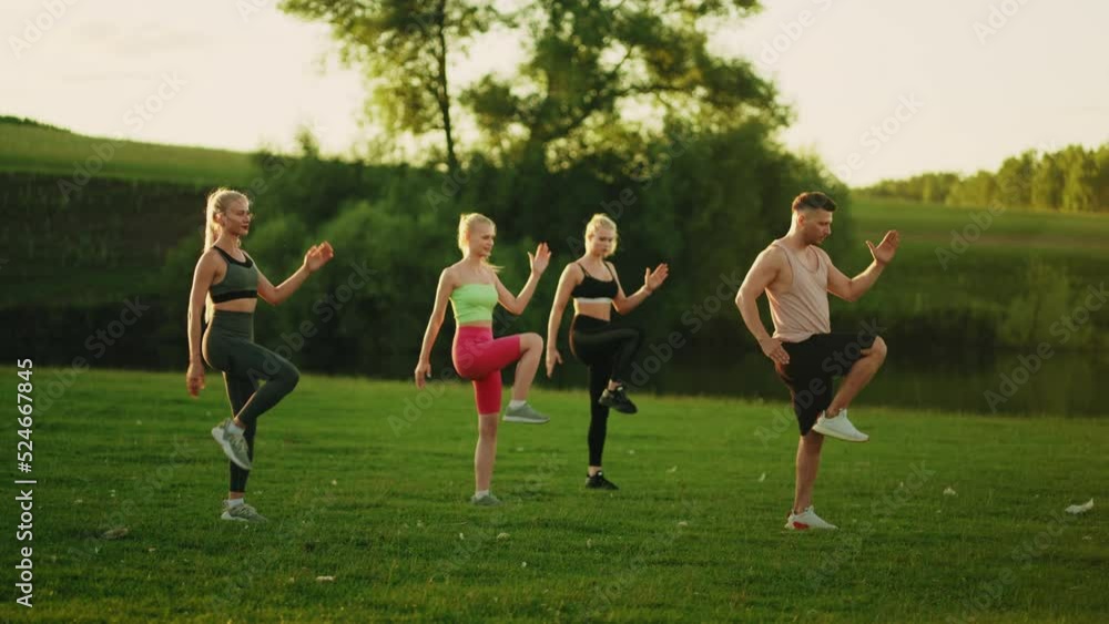 group fitness workout in open air, active lifestyle and sport, beautiful women and male coach group fitness workout in open air, active lifestyle and sport, beautiful women and male coach