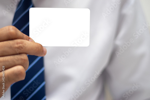 Businessman holding a blank card to put a message