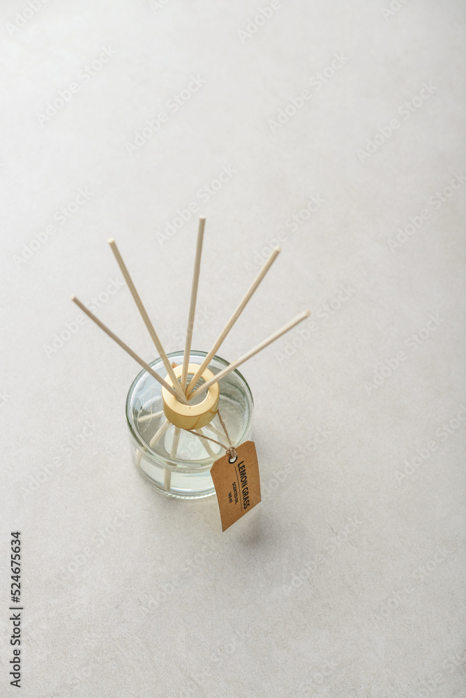 Fragrance diffuser for home on light concrete background Fragrance diffuser for home on light concrete background