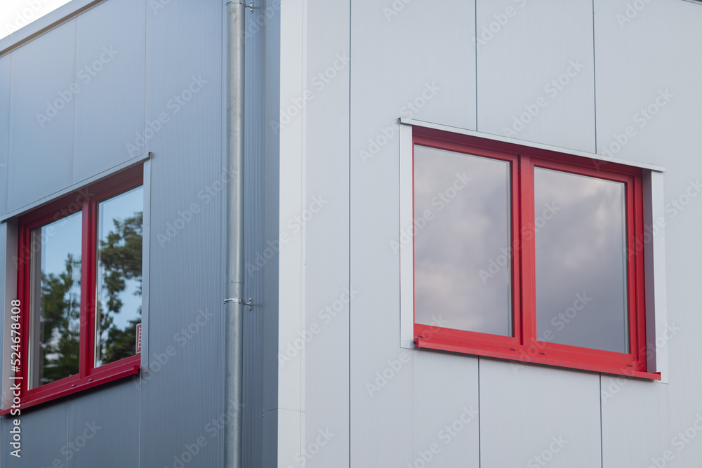 Fototapeta premium red and white windows at a modern building
